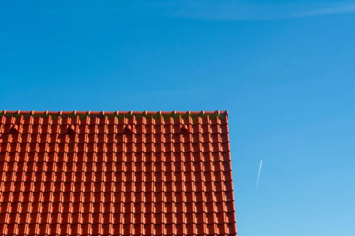 Tile roof gable in full sun, the kind of exposure that sets roof life in Detroit, MI